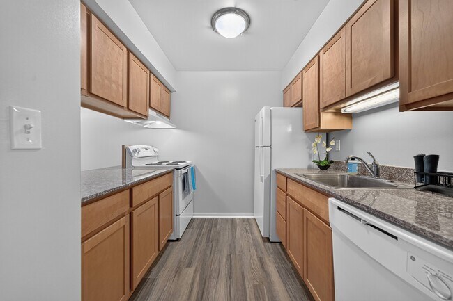 Efficient kitchen at Woodland Villa Apartments in Westland, MI. - Woodland Villa Apartments