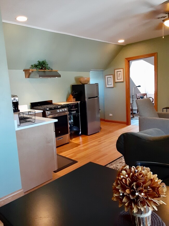 View of kitchen and door to bedroom - 2422 N Drake Ave Unit 3rdFloor