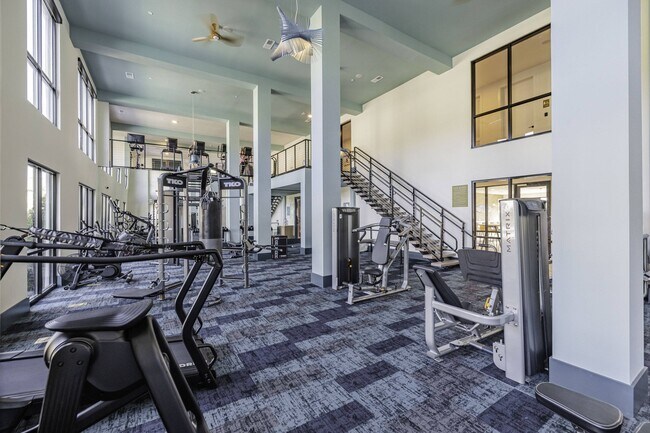 Two-Story Fitness Center with Cardio, Resistance & Free Weights - Forena Luxury Living