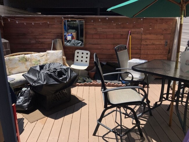 Photo - Beautiful Townhome with large fenced back patio, second story balcony, and two covered parking spots