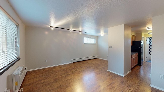 Spacious living area with hardwood floors - 1345 High