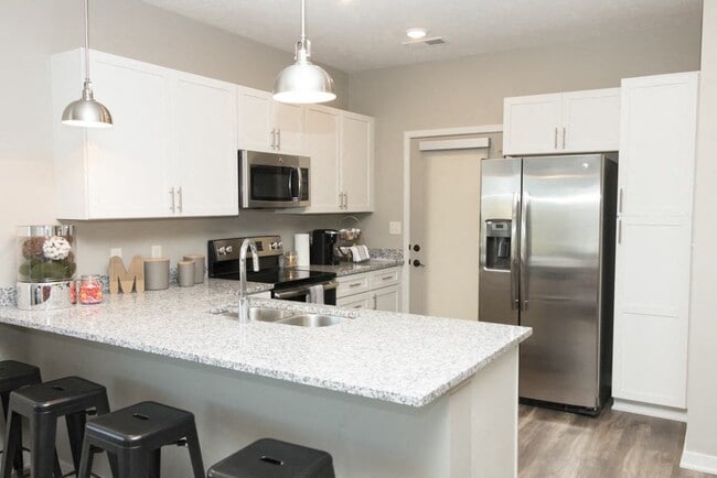 Our spacious kitchens offer modern appliances and ample counter space, perfect for cooking and entertaining.
