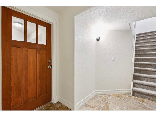 stairs down to unit with private door/mudroom - 1005 Laporte Ave Unit Basement