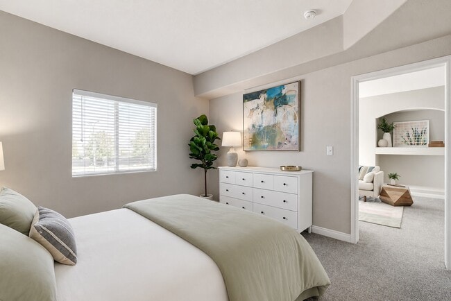 Elevate your living at Horizon Ridge with this cozy, light-filled bedroom. Featuring modern decor and serene views, it's the perfect retreat. Don’t miss your chance to make this sanctuary your own—schedule a tour today!
