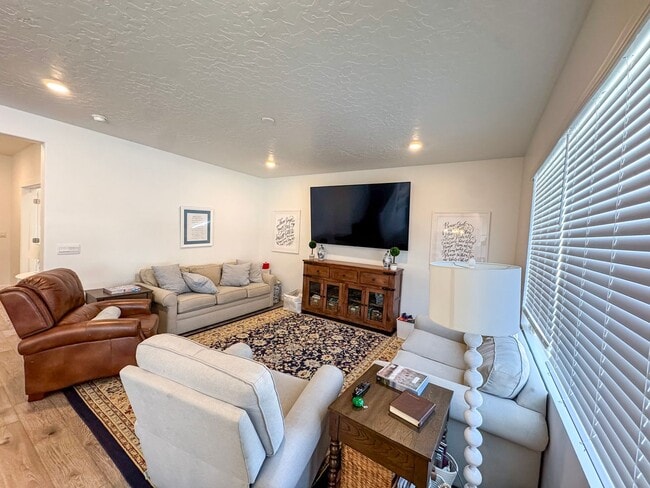 Photo - Beautiful 4 Bed 3.5 Bath Home in Syracuse + Bonus Room + Fenced Yard + 86” TV Included