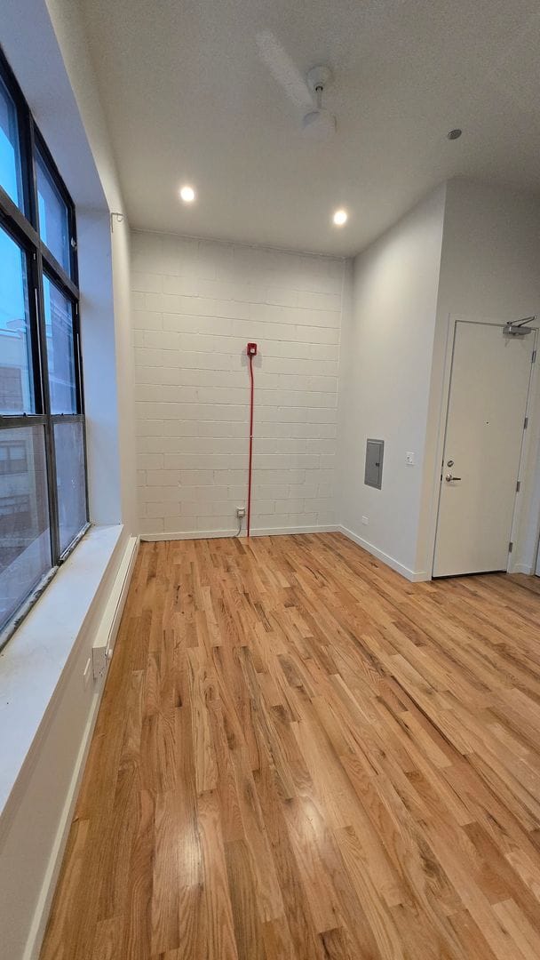 Photo - Brand New Studio in Wicker Park. 12' Ceilings. Huge Windows, Elevator Building. Roof Deck. Free I... Unit 403