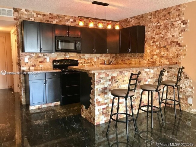 Photo - 600 Three Islands Boulevard Unidad 1018