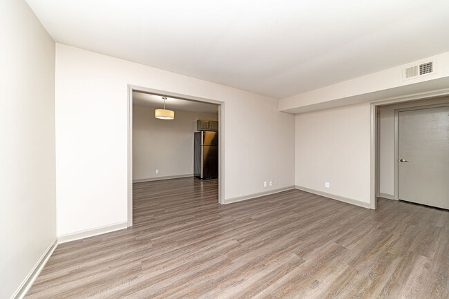 Bedroom with hardwood-style flooring