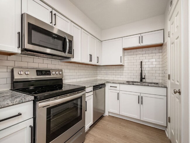 Photo - Half Month FREE — Updated 2BR w/ In-Unit Laundry, Central A/C + 2 Parking Spots | Touring starts ... Unit I