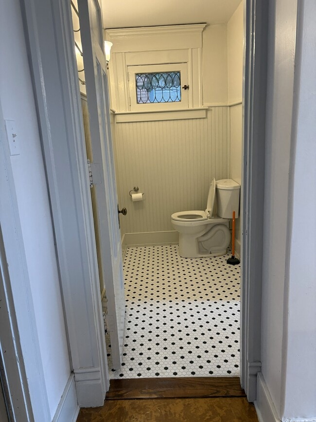 Looking into Bathroom. New tile floor - 1445 S 4th St Unit 2