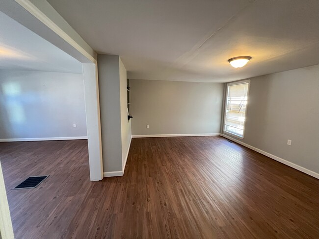 Dining room and living room - 2057 High St Townhome