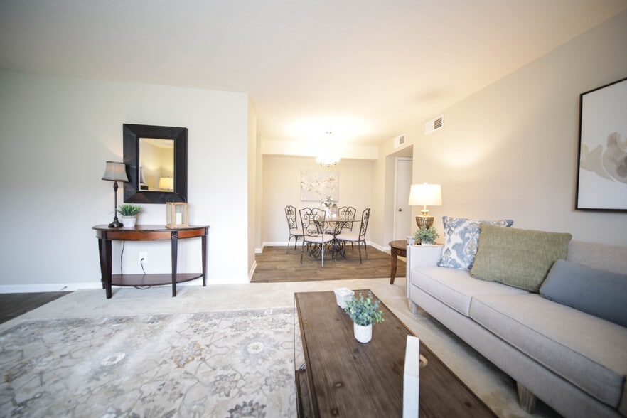 Spacious, landscaped outdoor terrace with lush seating, grills and a fire pit