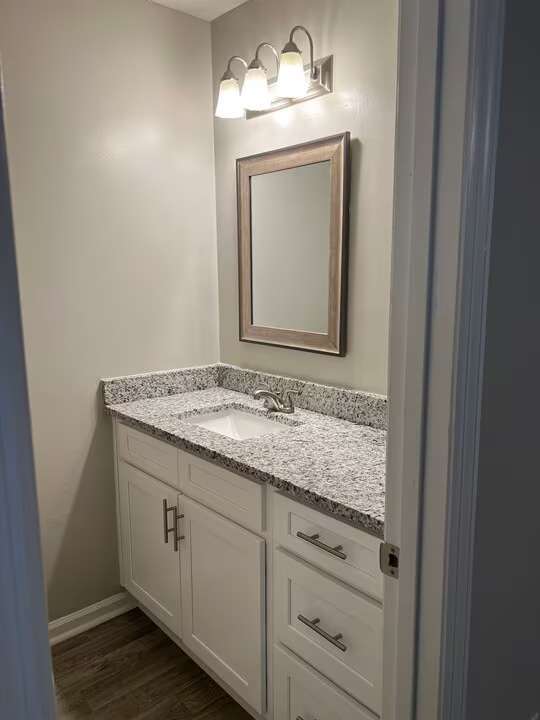 Elevate your living experience at Arbor Terrace with this beautifully designed bathroom featuring elegant granite countertops and modern fixtures. Enjoy a perfect blend of style and comfort. Schedule your tour today to see it in person!