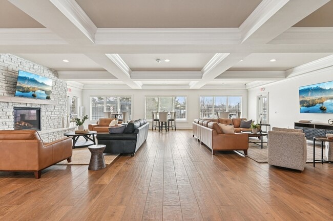 Gather the crew for the ultimate hangout in this expansive clubhouse, featuring a cozy stone fireplace and an elegant coffered ceiling that levels up the vibes.