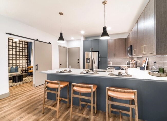 Large kitchen islands with built-in seating create the perfect space for dining, entertaining, meal prep, and everyday gathering.