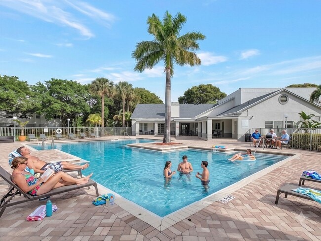 Relax by the sparkling pool at Ponte Verde Apartments at Palm Beach Lakes, where a vibrant community meets tropical beauty. Dive into leisure and enjoy the serene surroundings. Schedule a tour today to see your new sanctuary! - Ponte Verde Apartments At Palm Beach Lakes