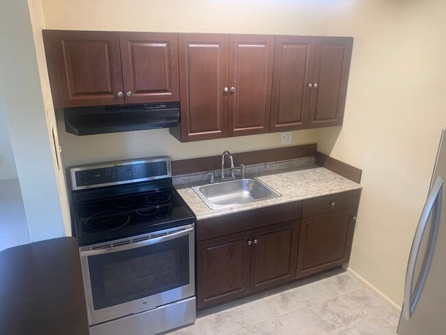 Kitchen- Cabinet, Stove, Sink - 3112 SW 12th Plz Unit 1