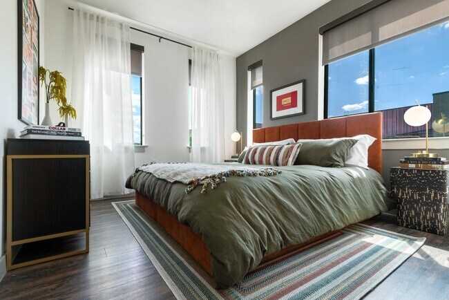 Spacious Bedroom with Plenty of Natural Light and Wood Flooring