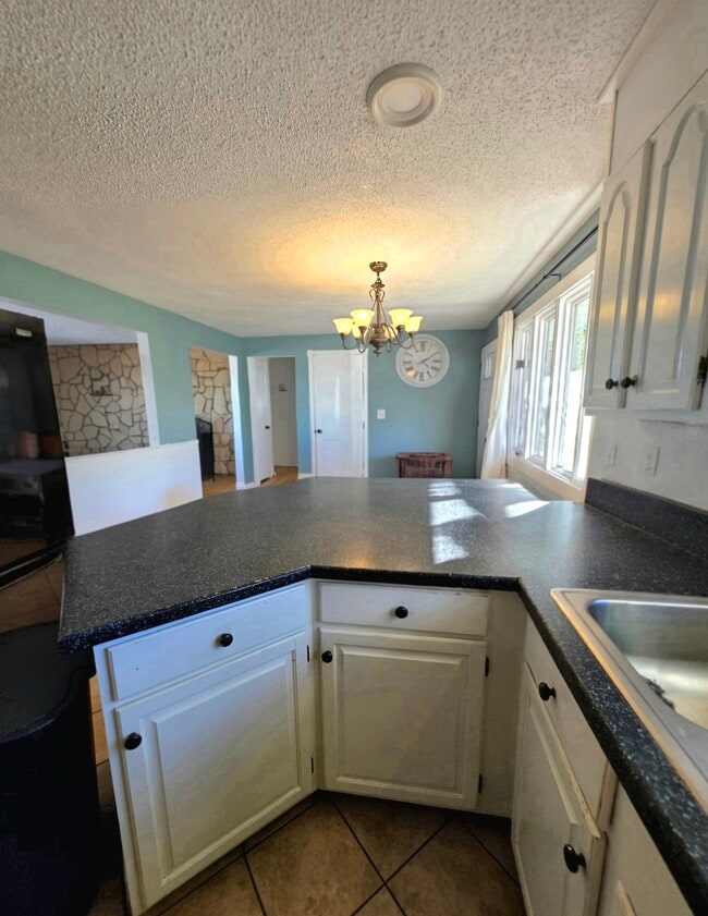 Kitchen into entry - 1409 2nd West Hill Dr