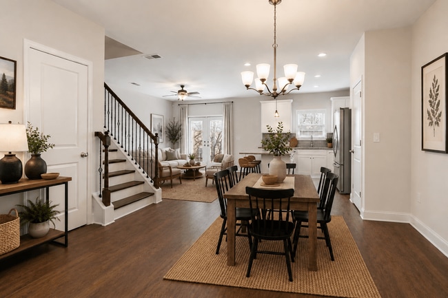 A view of the spacious kitchen, dining area, and stainless steel appliances