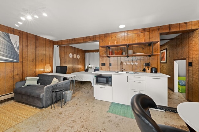 Enjoy a kitchenette, dining area, living area, & sleeping area. - Cross Lake Estates - Furnished Rentals