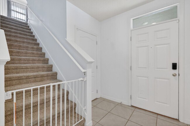 Photo - Available Now! 4BR Home in Avalon Park with Fenced Yard & Resort-Style Amenities