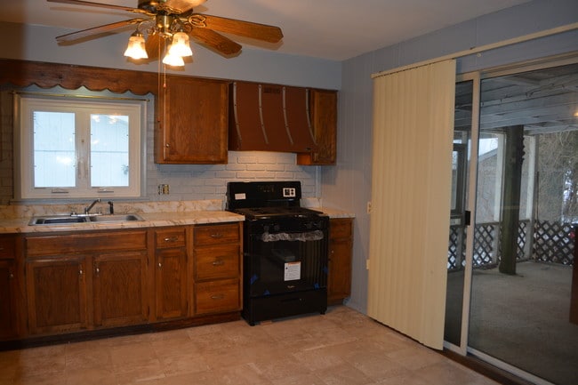 Kitchen with sliders to screened porch - 127 Sheldon Ave Unit 127