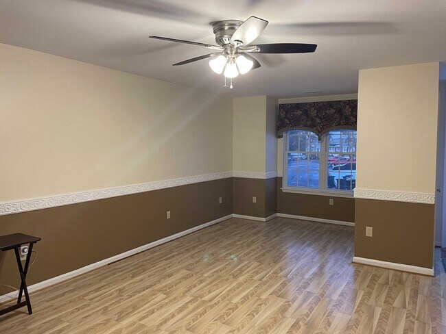 Photo - Spacious 3BR Townhome with Walkout Basement, Deck, Fenced Yard, Central A/C + Assigned Parking