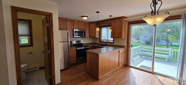 Photo - Bright & Spacious 2BR Townhome w/ Finished Basement, Deck & Parking