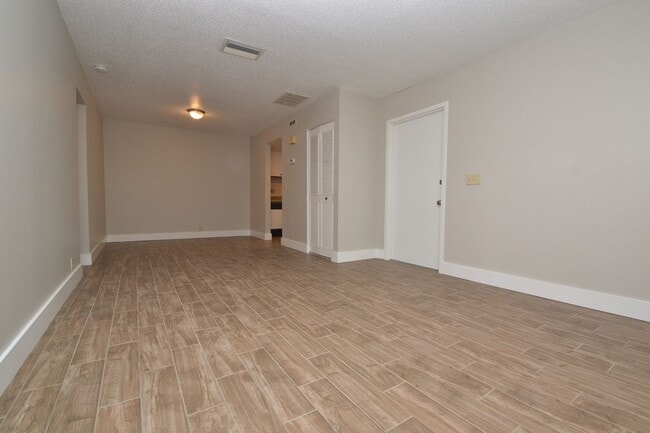 Photo - Nicely Updated 1/1 Condo in Winter Springs ~ Wood Plank Tile Floors and Large Screened Patio! Unit 4