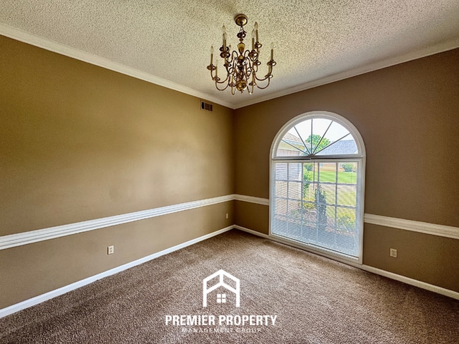 Photo - Spacious 3BR/2BA Near Southwind | 1,958 Sq Ft, Brick Fireplace, 2-Car Garage & Quiet Cove