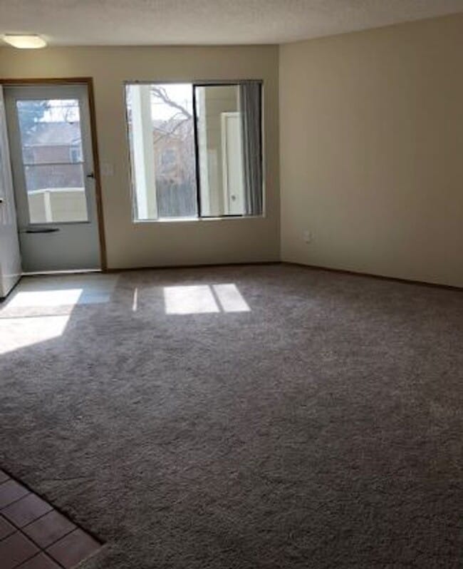 Photo - 2 BR/1BA | Newly Renovated Unit | Front Patio| Fireplace in living room!