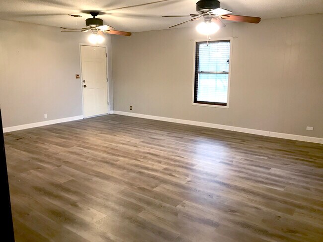Large living room with luxury waterproof wood look vinyl flooring - 703 Lee St Casa