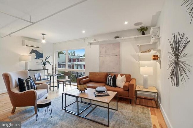 Open greatroom with built-in shelves - 1514 Newton St NW Unit 302