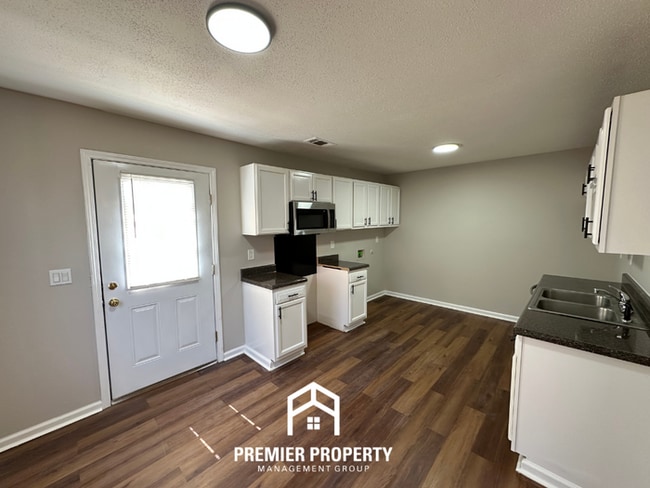 Photo - Spacious 4BR/2BA Home in 38141 | Vinyl Flooring & Large Fenced Backyard