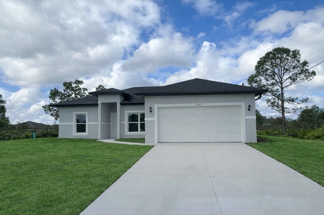Building Photo - MOVE IN READY & BRAND NEW! Spacious 4 BD/ 2BA/ 2 Car Garage in Lehigh Acres