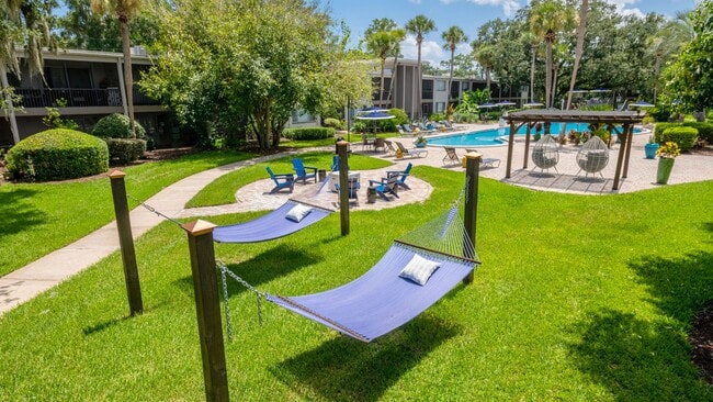 Revel in elegant outdoor amenities like the blissful hammock garden, vivacious fire pit, and vibrant resort-style pool.