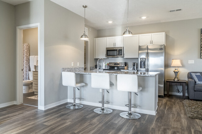 Modern kitchens offer stainless steel appliances and plenty of counter space for all your cooking needs. - The Villas at Mahoney Park Apartments