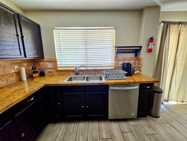 Photo - STUNNING 4 Bed, 2.5 Bath Oasis with Pool Your Dream Home Awaits!