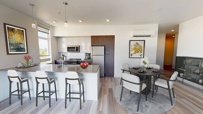 Modern kitchen with large breakfast bar - Modera Redmond Apartments