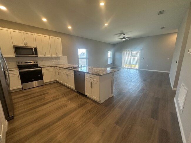 Photo - AVAILABLE MID APRIL- 4 Bedroom 2 bathroom 3 Car Garage NE Cape Coral Home with Screened Lania