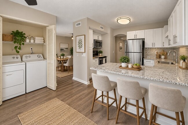 Explore the modern charm of Whaler's Cove with this beautifully designed kitchen and dining area. Enjoy spacious layouts and stylish finishes that elevate your living experience. Don't miss out—schedule your tour today!