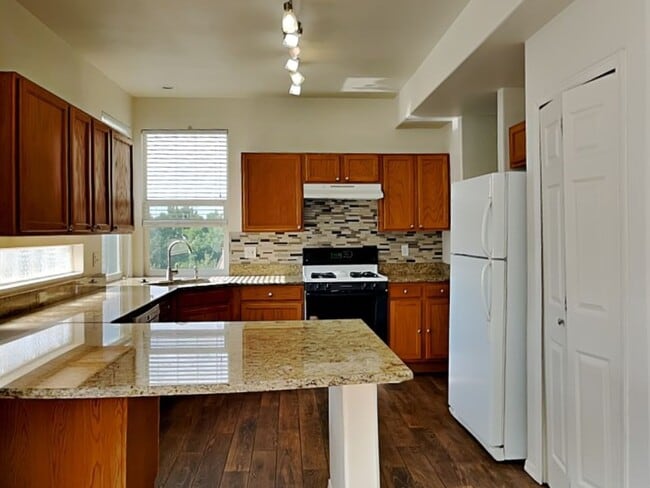 Photo - Single family home w/ 4 bedrooms, 3.5 baths, finished walkout basement!