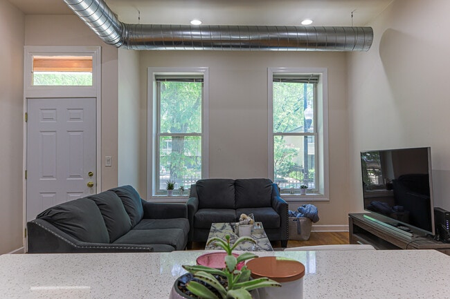 Apt 2 (3bd/2ba) - Open Living Room / Kitchen - Harris Point Chicago