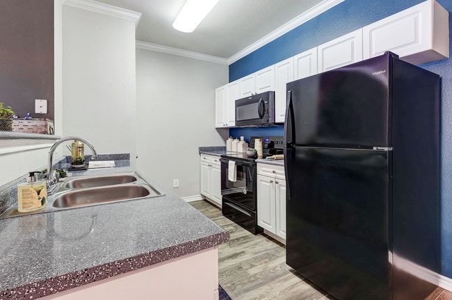 Eat In Kitchen with black appliances - Parkways on Prairie Creek