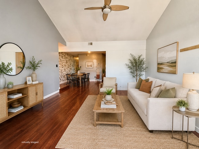 Building Photo - Top-Floor Plaza Condo with Vaulted Ceilings & Dual Balconies
