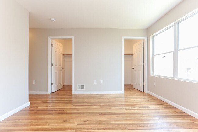 master bedroom with two walk in closet - 150 Leslie St Apartments Unit Studio