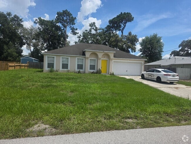 Building Photo - 4 bedroom 2 bathroom fenced in yard Rental