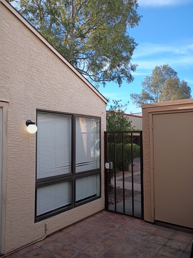 Gated entrance storage area living room window - 7618 E Callisto Cir Unit 122