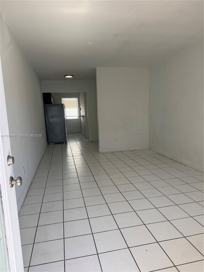 Building Photo - 7300 Harding Ave Unit 8